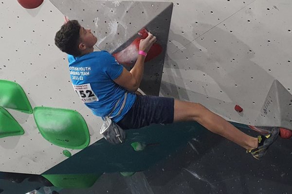 Pathway 1 Young man taking part in a bouldering competition at an indoor wall