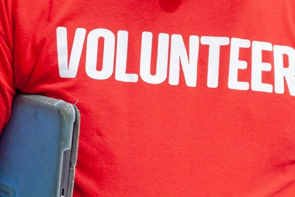 A red tshirt with Volunteer written on it