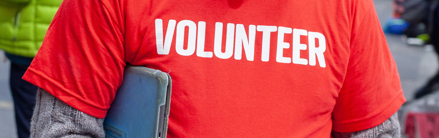 A red tshirt with Volunteer written on it