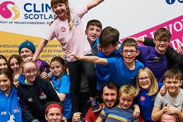 A group of young people at an indoor climbing wall
