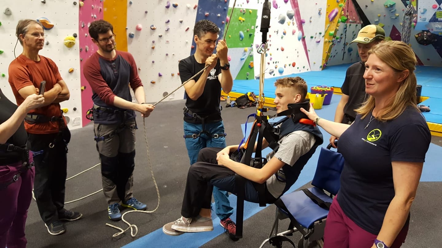 A group of people at a climbing wall